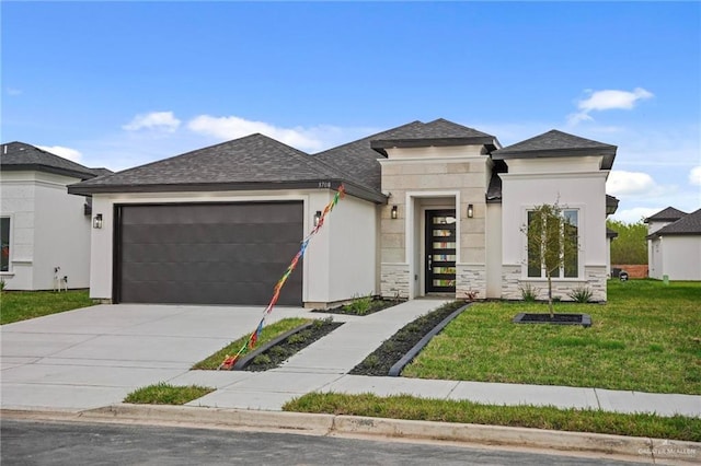 prairie-style home featuring a front yard, an attached garage, driveway, and stucco siding