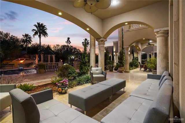 view of patio with a ceiling fan and outdoor lounge area