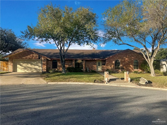 view of front facade featuring a front lawn and a garage