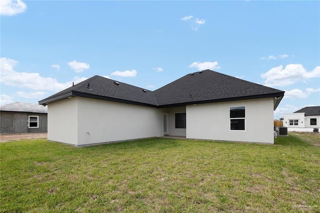 1920 Lime St, San Juan, TX 78589 - back of house featuring a yard and stucco siding