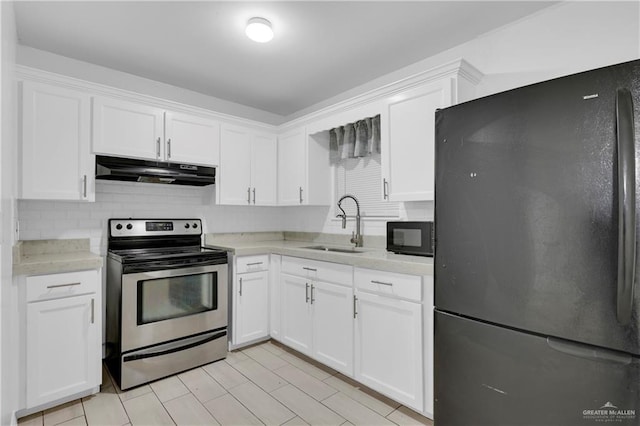 kitchen with sink, black appliances, and white cabinets