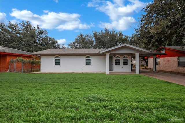 single story home with a carport and a front yard