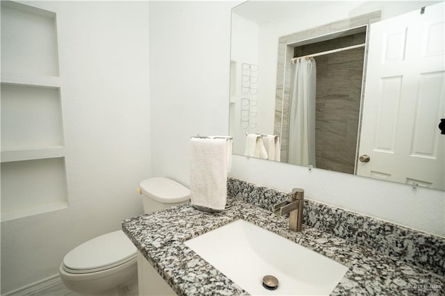 813 W 13th St, San Juan, TX 78589 - bathroom featuring toilet, vanity, and a shower with curtain