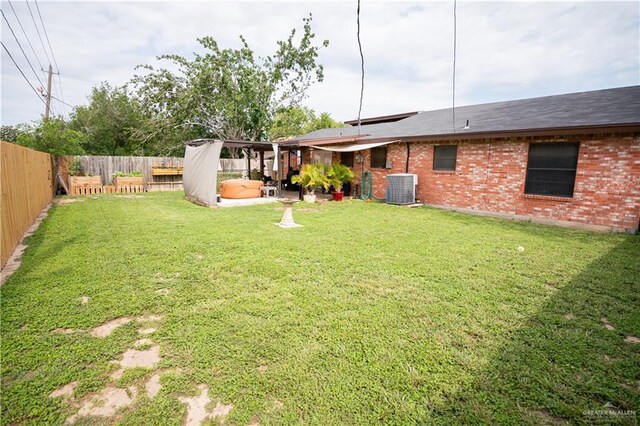 813 W 13th St, San Juan, TX 78589 - view of yard with central air condition unit