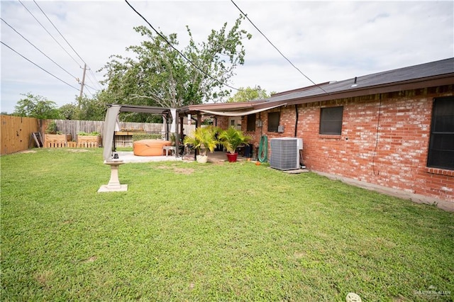 813 W 13th St, San Juan, TX 78589 - view of yard with central AC and a patio