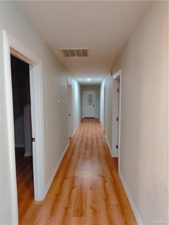 hall with light hardwood / wood-style flooring