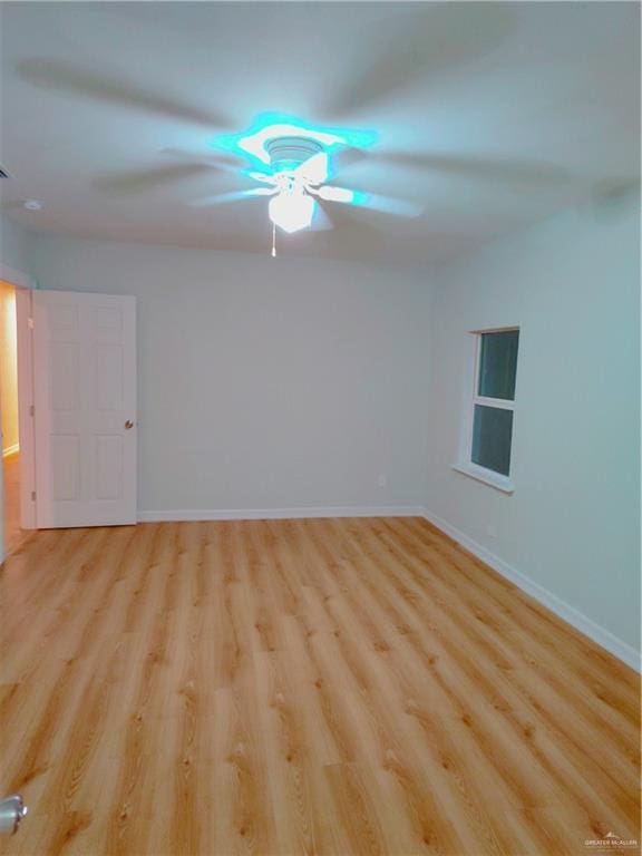 unfurnished room with ceiling fan and light hardwood / wood-style flooring