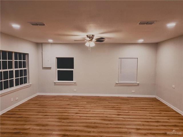 unfurnished room featuring ceiling fan and light wood-type flooring