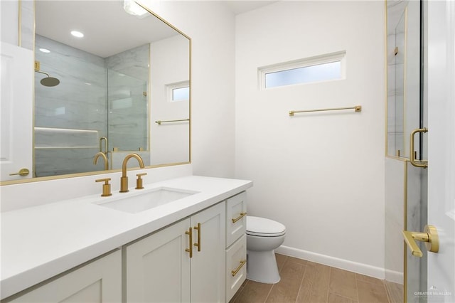 820 N Trinity St, Edinburg, TX 78541 - bathroom with vanity, a marble finish shower, and recessed lighting