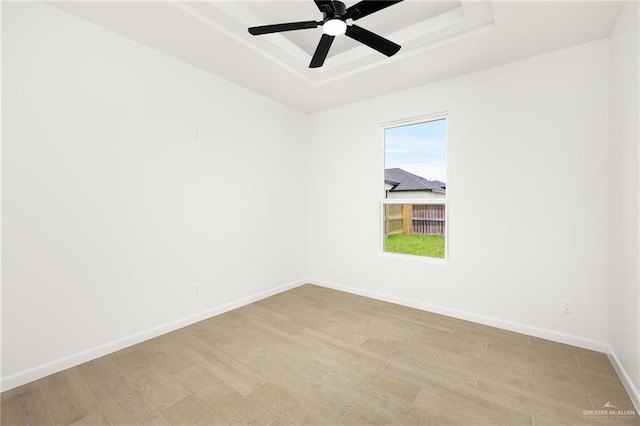 820 N Trinity St, Edinburg, TX 78541 - empty room featuring a raised ceiling, light wood-style floors, and ceiling fan