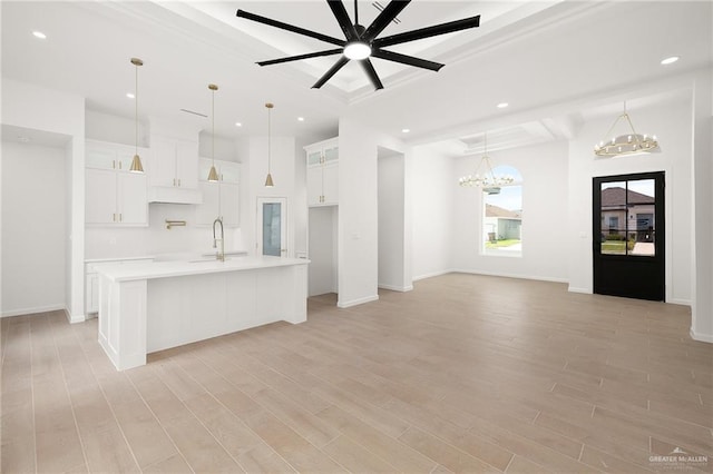820 N Trinity St, Edinburg, TX 78541 - kitchen featuring light countertops, a chandelier, white cabinetry, recessed lighting, and light wood-style floors