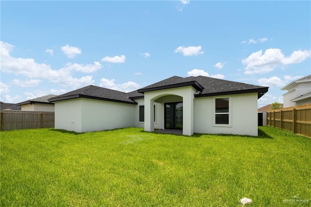 820 N Trinity St, Edinburg, TX 78541 - back of property with stucco siding and roof with shingles