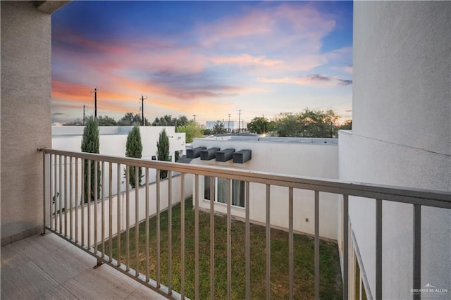 view of balcony at dusk