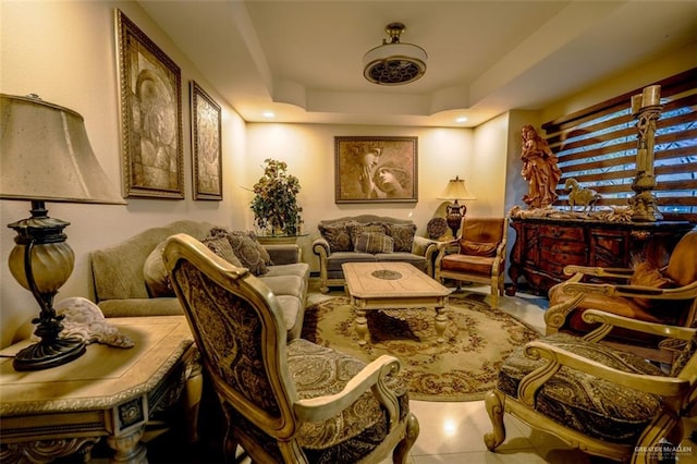 sitting room with a raised ceiling