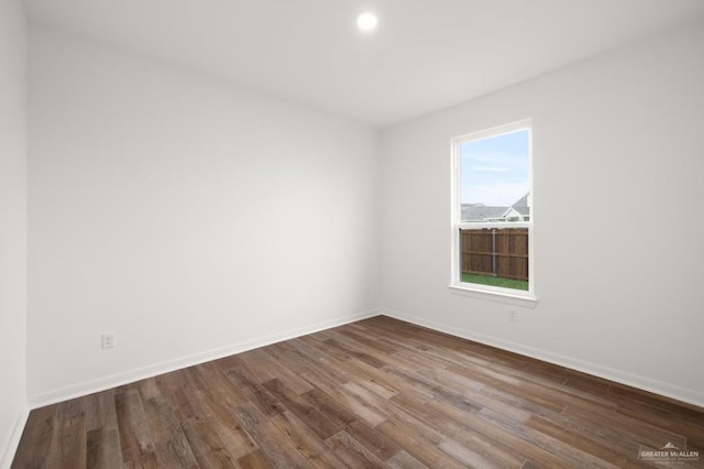 spare room with hardwood / wood-style flooring