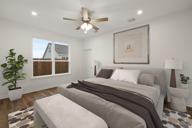 bedroom featuring dark hardwood / wood-style floors and ceiling fan