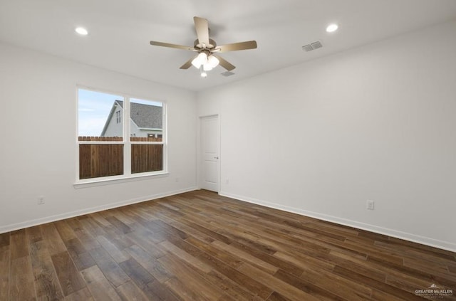 empty room featuring ceiling fan and dark hardwood / wood-style floors