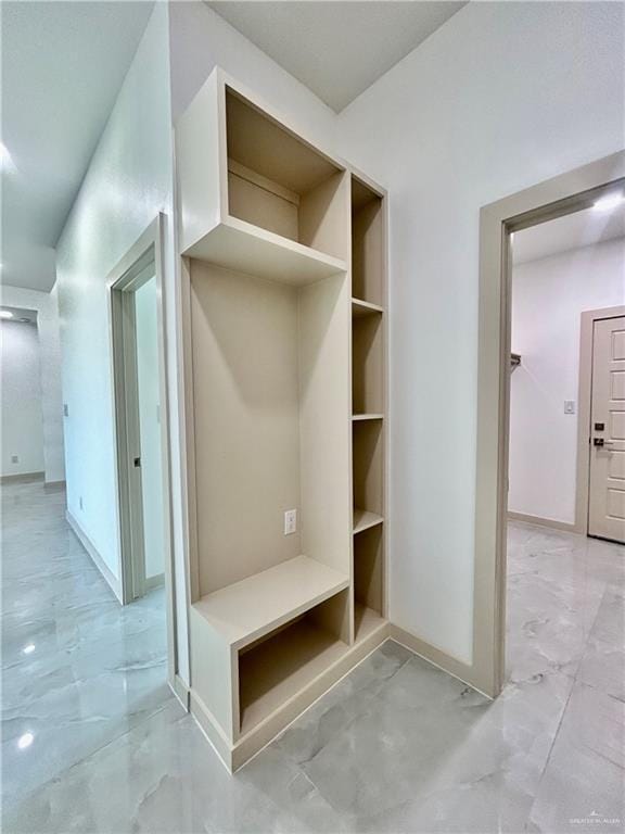 514 Oriole Dr, Los Fresnos, TX 78566 - mudroom featuring light marble finish flooring and built in shelves