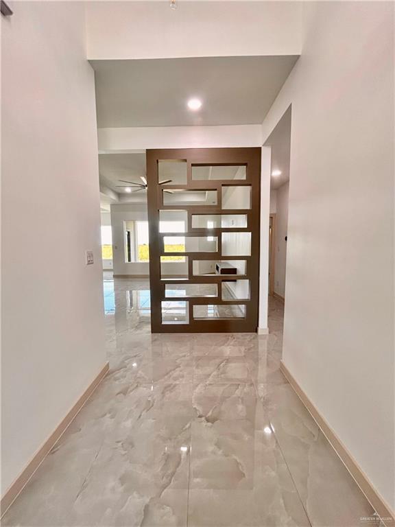 514 Oriole Dr, Los Fresnos, TX 78566 - corridor with marble tiled flooring
