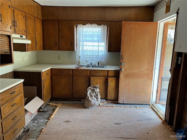 kitchen with sink and a textured ceiling