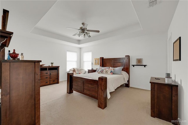 408 Bernal St, Edinburg, TX 78539 - bedroom with a raised ceiling, light colored carpet, baseboards, and a ceiling fan