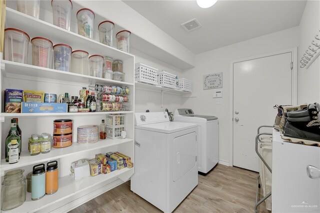 408 Bernal St, Edinburg, TX 78539 - laundry room with separate washer and dryer and light wood finished floors