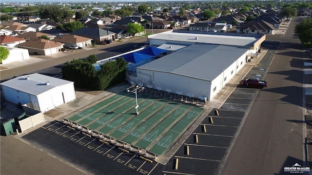 birds eye view of property with a residential view