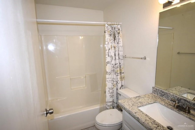 full bathroom with vanity, shower / bath combo with shower curtain, and toilet