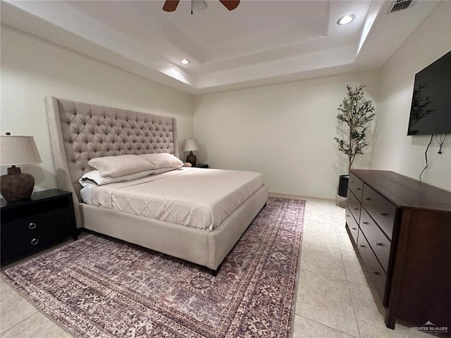 bedroom with a raised ceiling, ceiling fan, visible vents, light tile patterned flooring, and recessed lighting