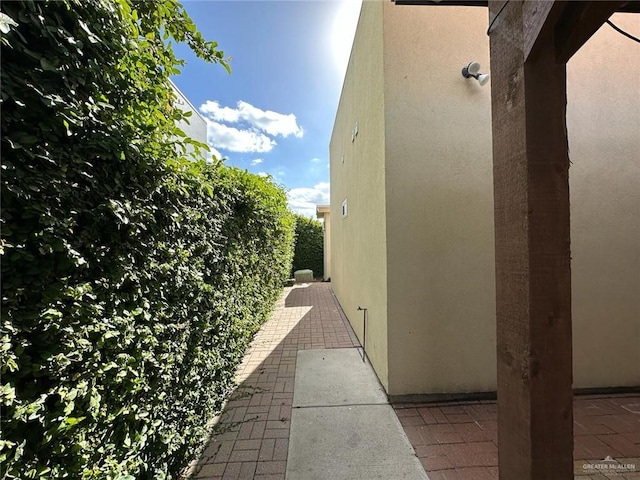 view of side of property featuring stucco siding