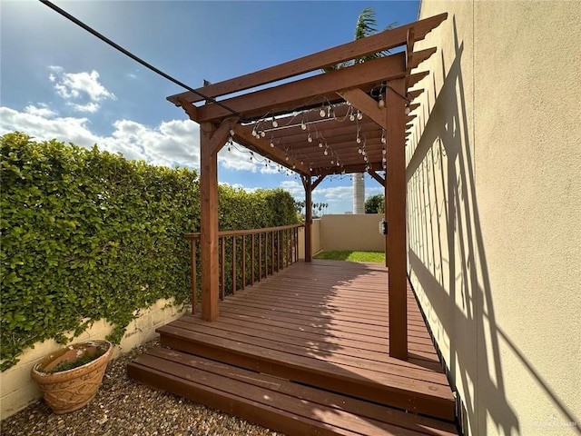 wooden deck featuring a pergola