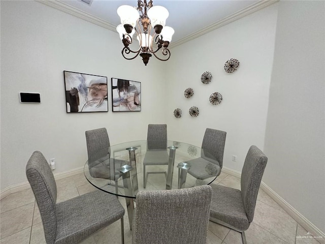 tiled dining space featuring a chandelier, baseboards, and ornamental molding
