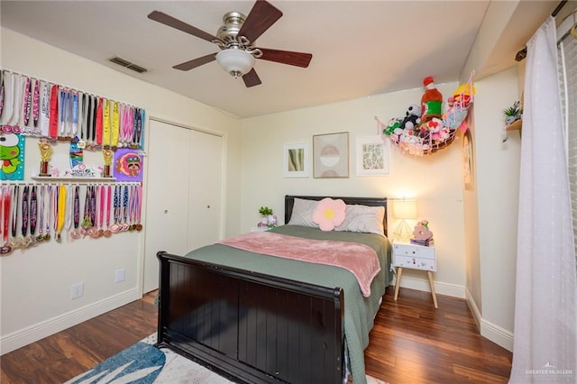 2405 E Lazy Lake Dr, Harlingen, TX 78550 - bedroom featuring wood finished floors, baseboards, a closet, and ceiling fan