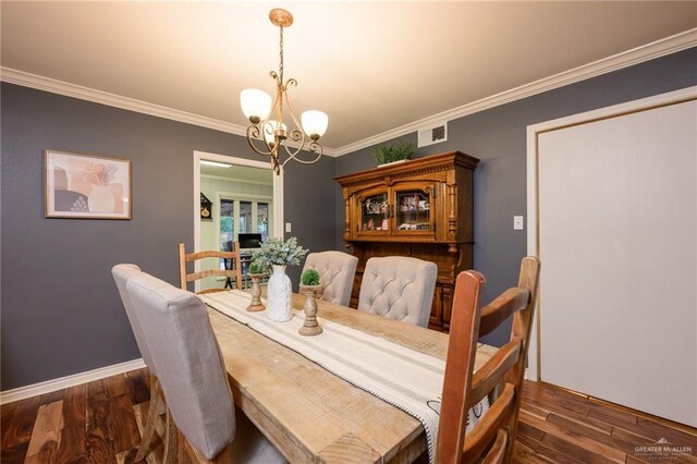 2405 E Lazy Lake Dr, Harlingen, TX 78550 - dining area featuring a chandelier, wood finished floors, ornamental molding, and baseboards
