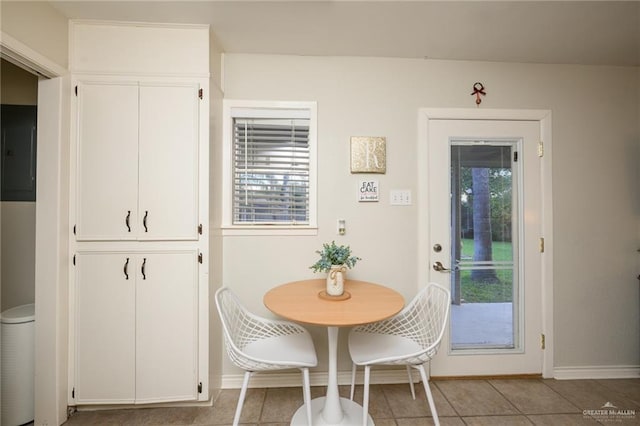 2405 E Lazy Lake Dr, Harlingen, TX 78550 - dining space with baseboards, light tile patterned floors, and electric panel