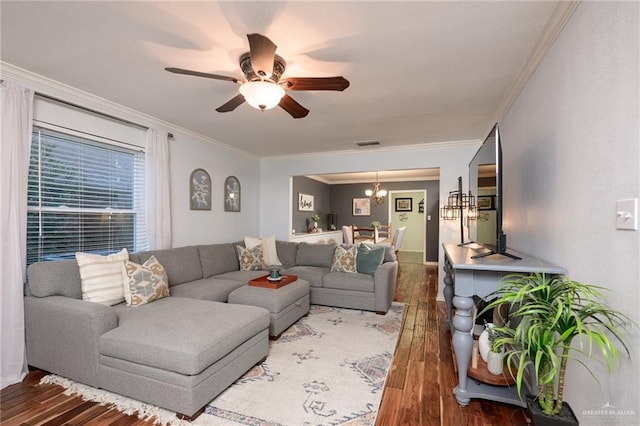 2405 E Lazy Lake Dr, Harlingen, TX 78550 - living area featuring wood-type flooring, ceiling fan, crown molding, a chandelier, and baseboards