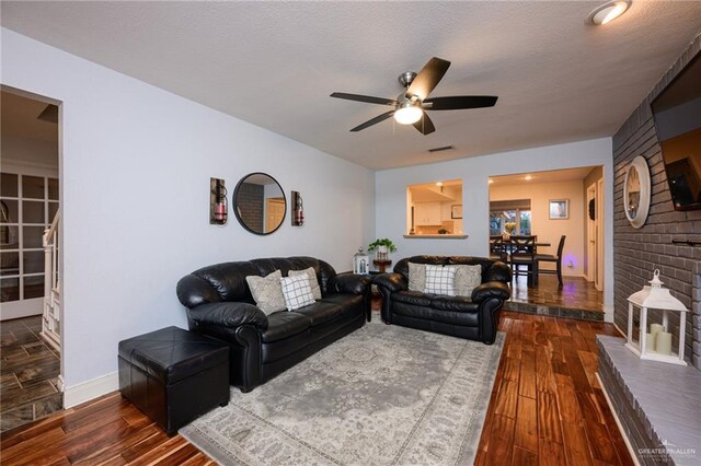 2405 E Lazy Lake Dr, Harlingen, TX 78550 - living area with a ceiling fan, hardwood / wood-style floors, and baseboards