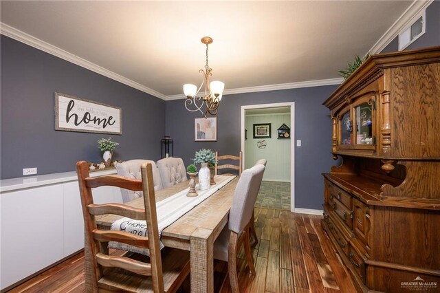 2405 E Lazy Lake Dr, Harlingen, TX 78550 - dining room with dark wood-type flooring, a chandelier, and crown molding