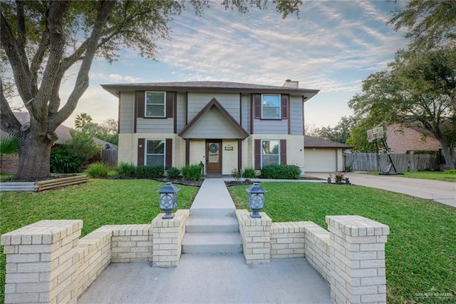 2405 E Lazy Lake Dr, Harlingen, TX 78550 - view of front of house featuring driveway, a garage, and brick siding