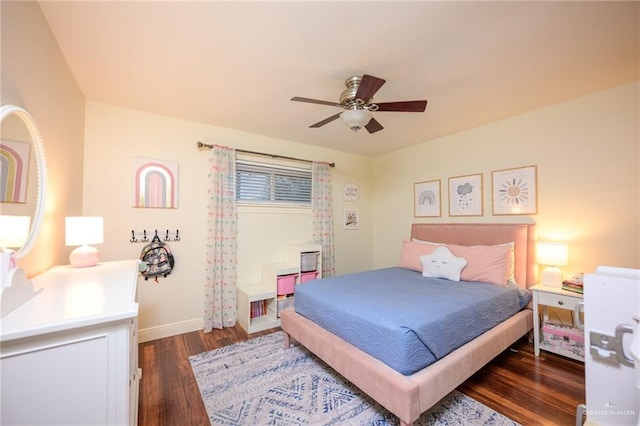 2405 E Lazy Lake Dr, Harlingen, TX 78550 - bedroom with dark wood-style flooring, baseboards, and a ceiling fan