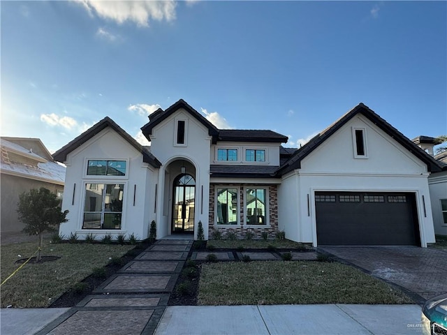 view of front of property featuring french doors and a garage