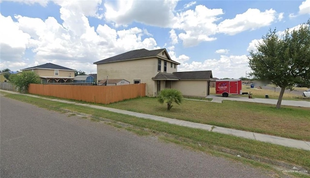 view of home's exterior with a yard