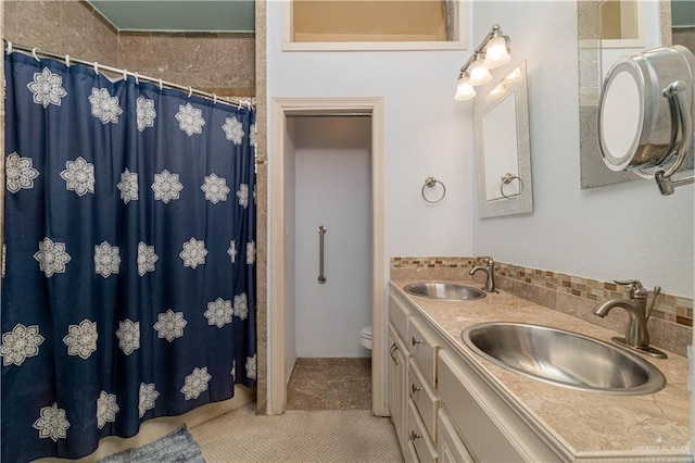 bathroom featuring walk in shower, tile patterned flooring, vanity, and toilet