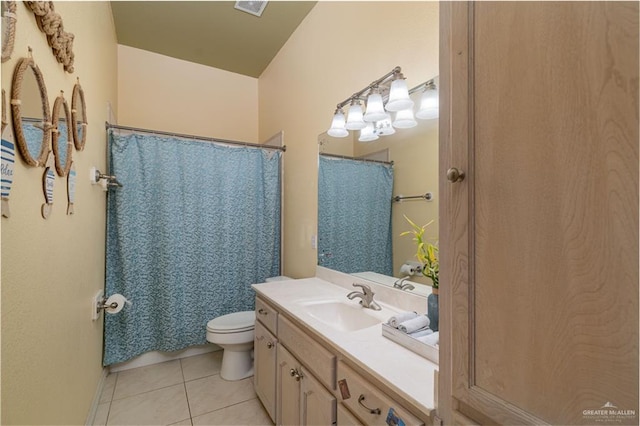 bathroom featuring tile patterned flooring, vanity, curtained shower, and toilet