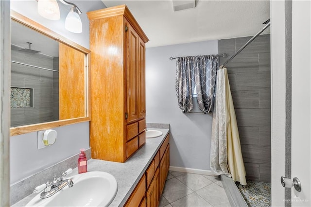 18064 Garrett Rd, Harlingen, TX 78552 - bathroom with a stall shower, double vanity, and tile patterned flooring