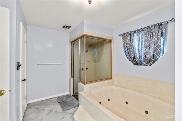 18064 Garrett Rd, Harlingen, TX 78552 - bathroom with a shower stall, a whirlpool tub, and tile patterned flooring