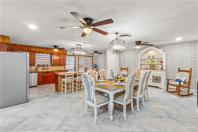 18064 Garrett Rd, Harlingen, TX 78552 - dining space with ceiling fan and a chandelier