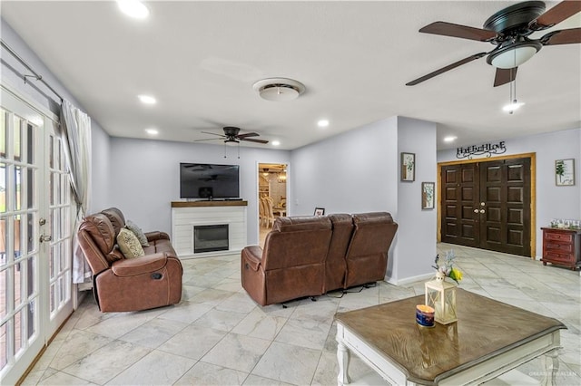 18064 Garrett Rd, Harlingen, TX 78552 - living area with a ceiling fan, a glass covered fireplace, recessed lighting, and french doors