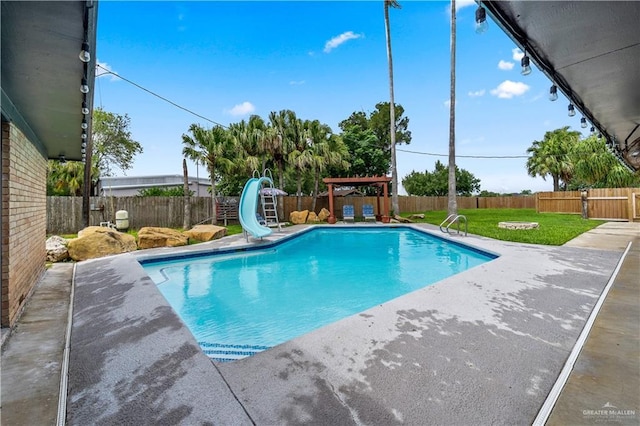 18064 Garrett Rd, Harlingen, TX 78552 - view of swimming pool featuring a water slide, a patio, and a fenced backyard
