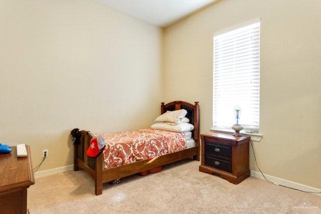 bedroom with light carpet